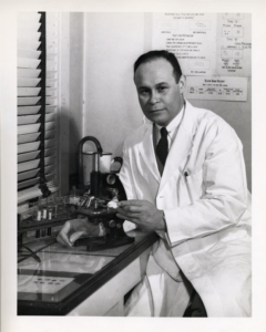 Charles Richard Drew with a Microscope
